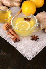 Healthy ginger tea with lemon and honey on table close-up
