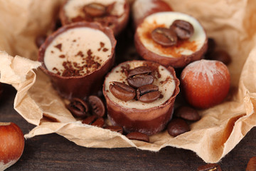 Tasty chocolate candies with coffee beans and nuts