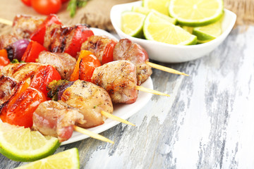 Pork kebab on wooden table close up