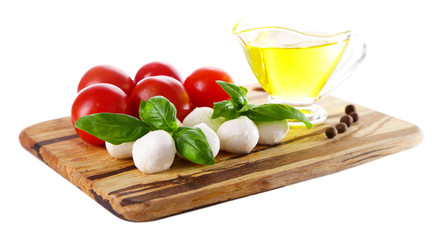 Composition with tasty mozzarella cheese balls, basil and red