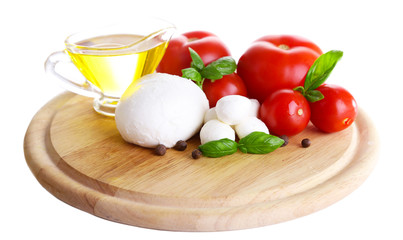 Composition with tasty mozzarella cheese balls, basil and red