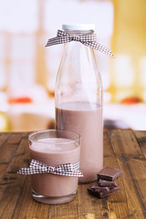 Chocolate milk in bottle and glass,