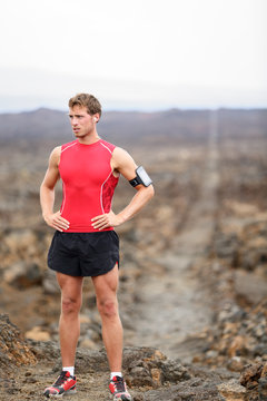 Runner man - portrait of running athlete resting