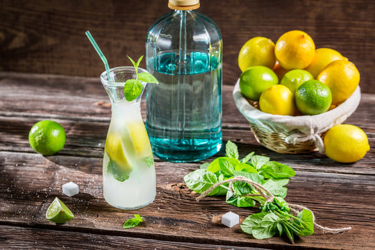 Lemon drink with mint leaf and citrus fruits