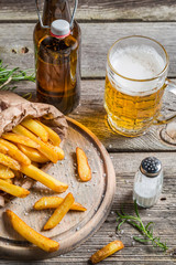 Fresh french fries served with beer