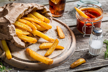 Closeup of homemade fresh fries with cold drink