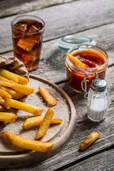 Fresh french fries served with cold drink