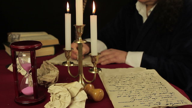 Chronicler writes in the candlelight