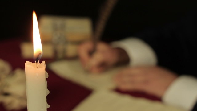 Chronicler writes in the candlelight