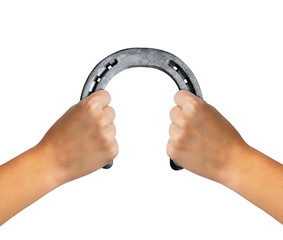 Hands holding horseshoe