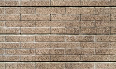 Stone granite wall of building for background and texture