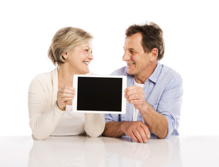 Senior couple with tablet