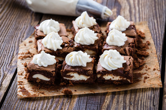 Cheesecake brownies with cream cheese swirled frosting