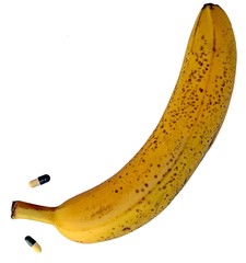 big yellow banana with two pills