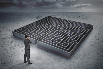 Composite image of thinking businessman