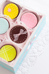 Homemade chocolate cookies decorated with royal icing.