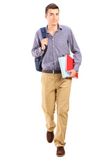 Male student walking with backpack