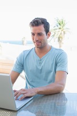 Young man using laptop