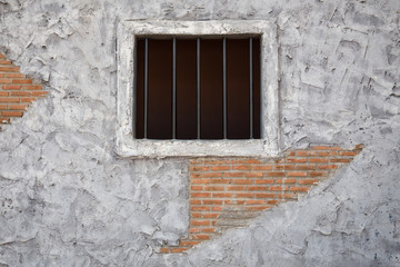 Jail window on Old cement wall