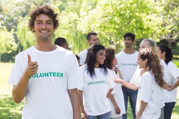 Confident volunteer showing thumbs up