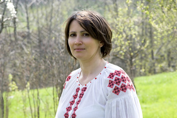 Smiling woman in Ukrainian traditional dress