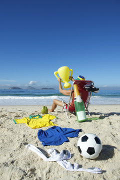 Champion Brazilian Football Player Celebrating in Beach Chair
