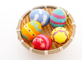 Fototapeta na wymiar Easter eggs and basket isolated