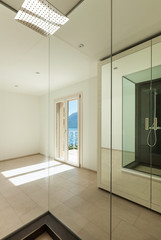 Interior of a new empty house, bathroom, view from the shower