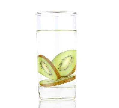 Three slices of kiwi in water isolated on white background