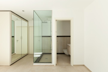 Interior of a new empty house, bathroom, shower view