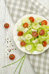 Salad with lettuce, tomatoes and cucumbers