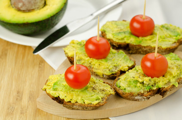 Avocado and tomatoes on seed bread