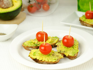 Avocado and tomato on bread