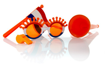 plastic glasses horn flute and flag in orange color