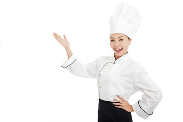 young female cook raise hands to show something