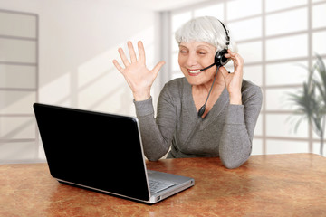 elderly woman at the computer communicates, mother, grandmother