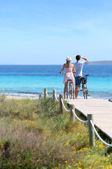Couple riding bikes on Formentera Island