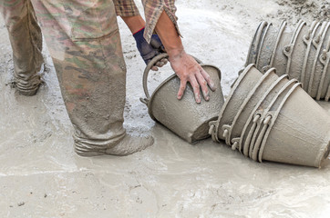 Construction worker mixing cement
