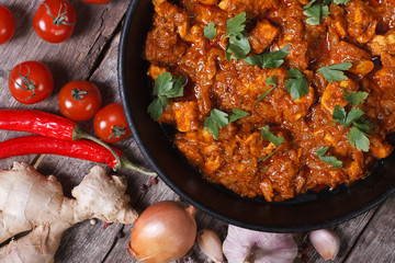 pieces of chicken fillet in curry sauce top view close-up