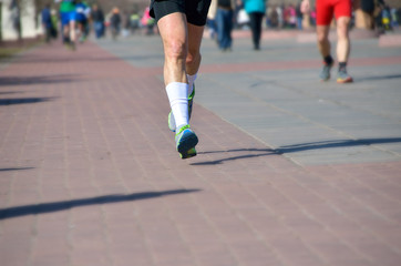 Marathon running race, people feet on road