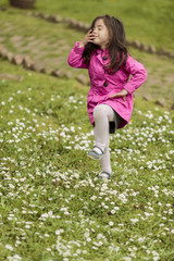 Little girl at the spring field