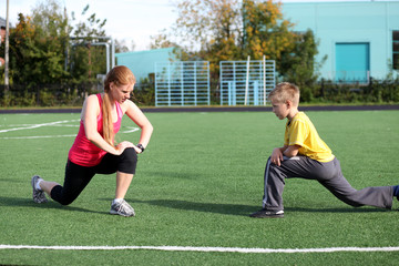 Athletic mother and son engaged in fitness