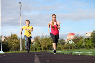 Athletic mother and son engaged in fitness