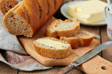 Sliced baguette with butter