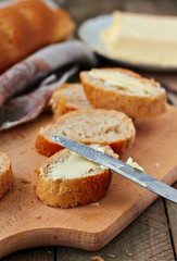 Sliced baguette with butter