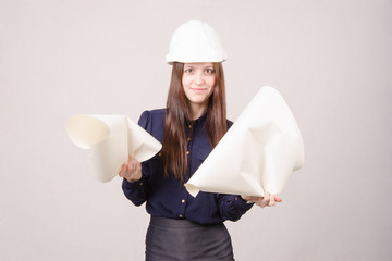 Woman architect in helmet drawing tears