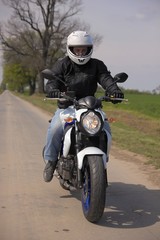 Fototapeta na wymiar Man driving motorcycle