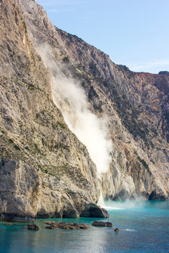 big pieces of rocks falling into the sea
