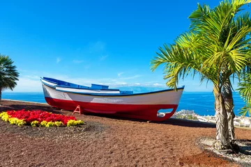 Zelfklevend Fotobehang Old boat. Puerto de Santiago, Tenerife, Spain © Andrei Nekrassov