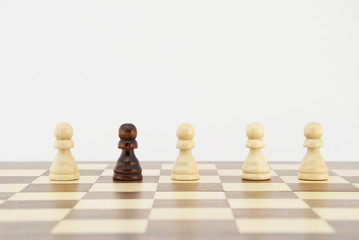 Chess pawn on chessboard